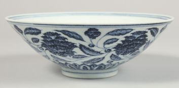 A CHINESE BLUE AND WHITE PORCELAIN BOWL, the exterior decorated with flowers and scrolling vine, the