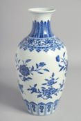 A CHINESE BLUE AND WHITE PORCELAIN VASE, decorated with sprays of flora, the base with six-character