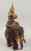 A RARE LARGE THAI GILT WOOD FIGURE OF A DEITY RIDING AN ELEPHANT, 47cm high