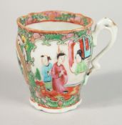 A CHINESE CANTON PORCELAIN TEACUP, 7cm high.