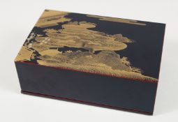 A JAPANESE BLACK LACQUERED LIDDED BOX, the lid with gilt decoration. 16.5cm x 11cm