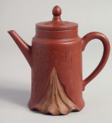 A TALL CHINESE YIXING TEAPOT AND COVER carved with script, with impressed mark to inner lid and