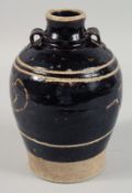 A CHINESE BROWN GLAZE SGRAFFITO CIZHOU WARE JAR, the body carved with ducks. 22.5cm high