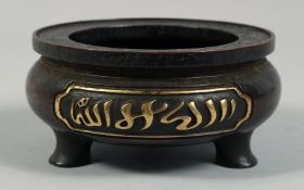 A CHINESE HEAVY BRONZE TRIPOD CENSER, with two panels of Islamic script in gilt, the base with