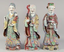 THREE LARGE 20TH CENTURY CHINESE FAMILLE ROSE PORCELAIN FIGURES, depicting the the Three Star