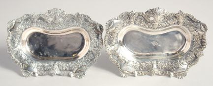 A PAIR OF 19TH CENTURY TURKISH OTTOMAN SILVER DISHES, stamped, weight 360g (together), 16cm x 11cm.