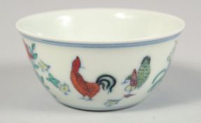 A CHINESE PORCELAIN CHICKEN CUP, the base with six-character mark, 8cm diameter.