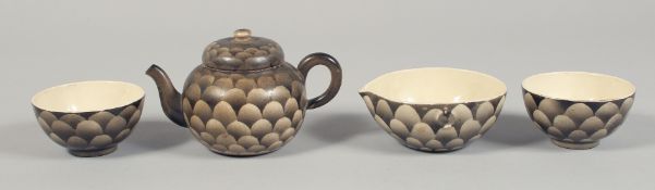A SATSUMA FOUR-PIECE TEA SET comprising small lidded teapot, milk jug, and two teacups. Teapot