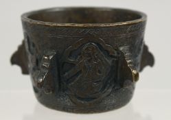 A RARE SMALL 18TH CENTURY PERSIAN ENGRAVED BRONZE MEDICINAL MORTAR, 6cm diameter.
