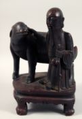 A LARGE 19TH CENTURY CARVED WOODEN FIGURE OF SHAO LOU AND DEER, (lacking antlers) raised upon a