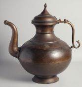 A VERY LARGE 19TH CENTURY INDIAN BULBOUS BRASS EWER, with zoomorphic handle and hinged lid, 42cm
