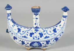A TURKISH IZNIK GLAZED POTTERY WATER FLASK painted with foliate decoration, 22cm wide