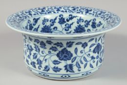 A CHINESE BLUE AND WHITE PORCELAIN WATER BASIN decorated with various flower heads and scrolling