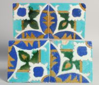 A SET OF FOUR PERSIAN SAFAVID CUERDA SECA GLAZED POTTERY TILES, each approx. 15cm square, (4).