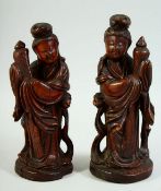 A PAIR OF CHINESE CARVED WOOD FEMALE FIGURES, 22cm and 21cm