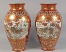 A LARGE PAIR OF JAPANESE KUTANI PORCELAIN VASES, finely painted with panels of mythological