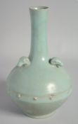 A CHINESE RU STYLE CELADON VASE, with three relief ram's heads to the shoulder, 26.5cm high.