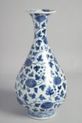 A CHINESE BLUE AND WHITE PORCELAIN VASE, decorated with flower heads and scrolling vine, 30cm high.