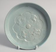 A CHINESE BLUE GLAZED CIRCULAR BRUSH WASHER, the interior centre with raised decoration depicting