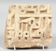 A 13TH / 14TH CENTURY PERSIAN ILKHANID TILE with early Kufic calligraphy, 15.5cm x 14cm