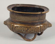 A SMALL CHINESE BRONZE CENSER, with lion dog handles and raised on three bamboo branch formed