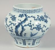 A CHINESE BLUE AND WHITE PORCELAIN JAR decorated with cherry blossom, pine tree, and bamboo. 20cm
