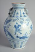 A LARGE CHINESE BLUE AND WHITE TWIN HANDLE URN, the handles moulded as chilong, painted with figures