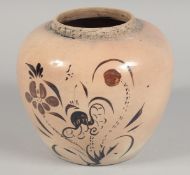 A CHINESE CIZHOU STYLE POTTERY JAR, painted in brown with flora, 17cm high.