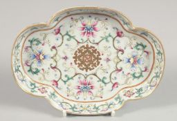 A CHINESE FAMILLE ROSE PORCELAIN QUATREFOIL BRUSH WASHER, finely painted with foliate motifs and