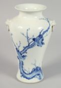 A CHINESE BLUE AND WHITE PORCELAIN TWIN-HANDLED VASE painted with birds on a branch, with characters