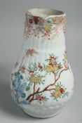 A CHINESE FAMILLE ROSE PORCELAIN JUG, painted with birds and native flora, 21.5cm high.