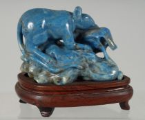 A SMALL CHINESE CARVED LAPIS LAZULI GROUP, depicting a rat upon a corn cob, with fitted wooden base,
