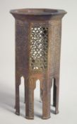 A FINE 19TH CENTURY ISLAMIC MINIATURE BRASS TABLE, the sides with panels of engraved and openwork