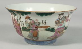 A CHINESE FAMILLE VERTE PORCELAIN BOWL, the exterior painted with theatrical figures in an outdoor