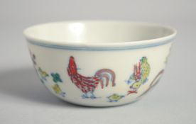 A CHINESE DOUCAI PORCELAIN CHICKEN CUP, 8cm diameter.