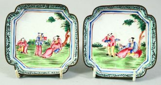 A PAIR OF CHINESE SQUARE FORM ENAMELLED DISHES, decorated with figures in a garden, 9.5cm square.