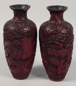 A PAIR OF 19TH CENTURY CHINESE CINNABAR LACQUER VASES, each decorated with figures in an outdoor