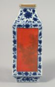 A SMALL CHINESE BLUE AND WHITE SQUARE FORM PORCELAIN VASE, with coral red panels of gilt decoration,