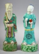 A PAIR OF 18TH CENTURY CHINESE PORCELAIN IMMORTAL FIGURES, 23cm and 22.5cm high.