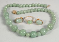 A 14CT GOLD AND JADE RING AND EARRINGS, together with a graduated jade bead necklace, (4 pieces).