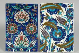 TWO TURKISH IZNIK GLAZED POTTERY TILES, each decorated with floral motifs, 23.5cm x 16cm and 24cm