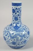 A CHINESE BLUE AND WHITE PORCELAIN VASE, finely decorated with dragons and flora, the base with