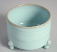 A CHINESE CELADON GLAZE TRIPOD CENSER, 10cm diameter.