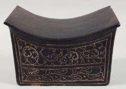 A CHINESE BROWN GLAZED SGRAFFITO CIZHOU STONEWARE PILLOW carved with foliate design and doorway