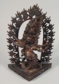 A TIBETAN BUDDHIST BRONZE OF RAHULA with snake's body, surrounded by a halo of fire.