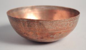 A FINE 18TH CENTURY PERSIAN SAFAVID COPPER BOWL, the exterior with engraved decoration and a band of