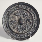 A RARE FINE CHINESE TANG DYNASTY LARGE BRONZE MIRROR, with relief decoration depicting various