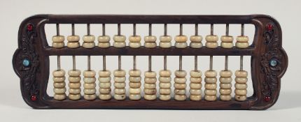 A CHINESE HARDWOOD AND JADE/HARD STONE ABACUS, 41cm wide