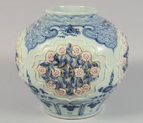 A LARGE CHINESE BLUE AND WHITE PORCELAIN JAR decorated with relief panels of flora and insects,