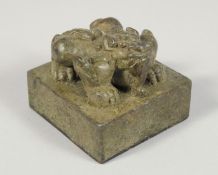 A CHINESE BRONZE SEAL, the top formed as a mythical beast.